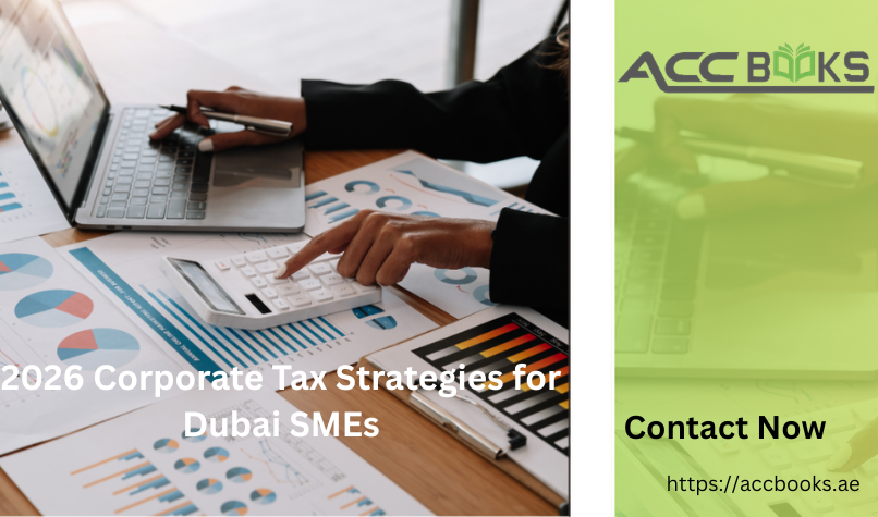 Business team reviewing 2026 corporate tax strategies for Dubai SMEs around a digital tablet showing UAE tax law updates