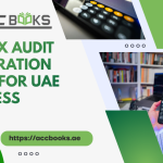 A professional UAE businessman reviewing financial documents and compliance checklists on a tablet, surrounded by calculators and VAT reports, symbolizing thorough Tax Audit Preparation for FTA regulations.