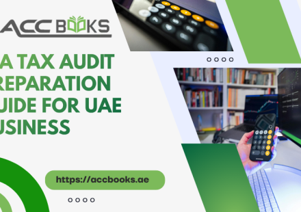 A professional UAE businessman reviewing financial documents and compliance checklists on a tablet, surrounded by calculators and VAT reports, symbolizing thorough Tax Audit Preparation for FTA regulations.