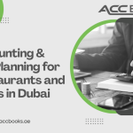 A warm, inviting Dubai restaurant interior featuring a well-dressed restaurant owner or manager reviewing financial documents and a tablet on a wooden table, alongside a cup of Arabic coffee and a traditional gold-plated calculator. In the background, the iconic Burj Khalifa is visible through the window, while a glowing graph shows upward profit margins, symbolizing strategic Tax Planning for Restaurants in Dubai's competitive hospitality sector.