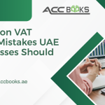 UAE finance team reviewing VAT returns on a tablet with warning signs and error icons, illustrating common VAT filing mistakes businesses must avoid.
