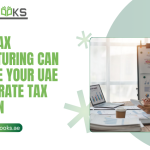 A detailed view of a wooden desk featuring a legal gavel, UAE dirham coins stacked in ascending order, and a pie chart diagram showing optimized revenue distribution across multiple corporate entities. A professional consultant is pointing to a strategic flowchart on a digital tablet, illustrating how effective Tax Structuring can legally minimize corporate tax liabilities. The UAE flag is subtly visible in the background, reinforcing the local regulatory context.