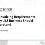 A close-up view of a professionally prepared UAE tax invoice displayed on a clipboard, featuring all mandatory fields including the supplier's TRN, invoice number, VAT amount, and the date of supply. A magnifying glass hovers over the document, highlighting the FTA-compliant details, while a checklist beside it marks off key VAT Invoicing Requirements such as "TRN Displayed," "Tax Rate Specified," and "Invoice Numbered Sequentially." A laptop in the background displays the FTA EmaraTax portal, and a UAE flag sits in the corner, reinforcing the regulatory context of VAT-compliant invoicing for UAE businesses.